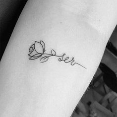 a small tattoo with the word love on it