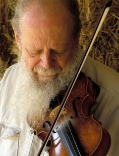 an old man with a long beard playing the violin