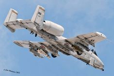 an air force jet flying through the sky