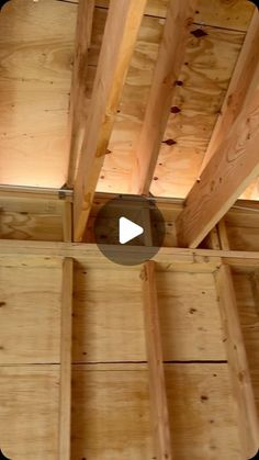 the inside of a wooden structure with wood beams and ceiling joisting in it