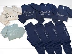 six personalized onesuits are laid out on a white background with the names of their babies