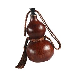 a wooden vase with a tassel on the top and a rope around it's neck