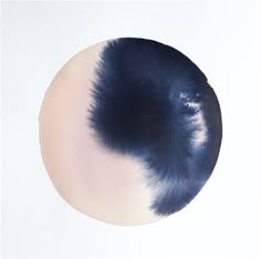 a circular painting with dark blue and white colors on it's surface, in the middle of an off - white background