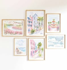 six watercolor paintings hang on the wall