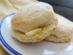 two biscuits on a plate with butter in the middle