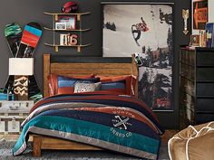 a bed room with a neatly made bed and a skateboard on the wall behind it