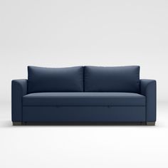 a blue couch sitting on top of a white floor