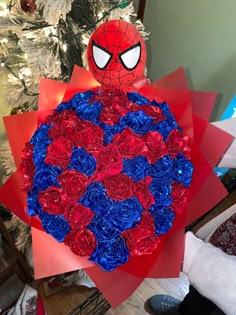 a spiderman bouquet made out of red, white and blue flowers