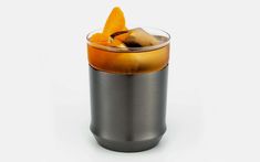 an orange slice is placed on top of the drink