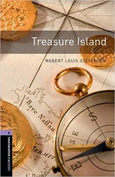 a compass and two gold coins on top of a map with the words treasure island