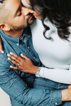 a man and woman embracing each other