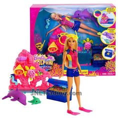 the barbie doll is in its box and next to it's toy figure set