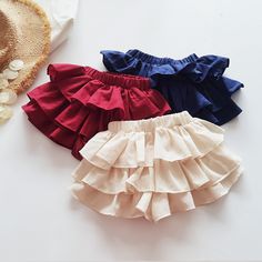 Solid Color Layered Ruffled Tutu Skirts Toddler Girl Wholesale Clothing Wholesale Solid Cotton Bottoms With Ruffles, Cute Red Ruffled Bottoms, Cute Cotton Mini Skirt With Ruffles, Red Cotton Ruffle Skirt, Red Cotton Ruffled Skirt, Cute Solid Color Summer Skirt, Cute Cotton Ruffled Skort, Cute Cotton Ruffle Skirt, Cute Cotton Ruffled Skirt