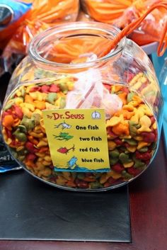 a fish bowl filled with lots of different types of food in it's display