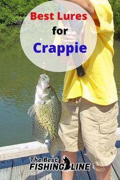 a young boy holding a fish while standing on a dock with the caption best lures for crappie