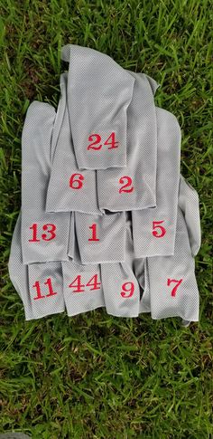 the numbers are laid out in rows on the grass, and there is no image here to provide a caption for