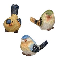 three ceramic birds sitting on top of each other