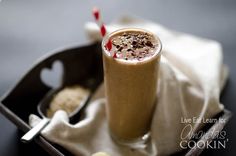 a chocolate milkshake in a glass with a straw