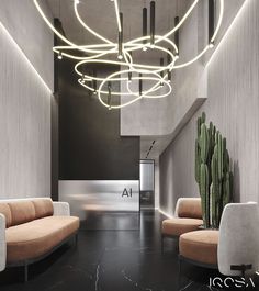 an elegant lobby with modern lighting and seating