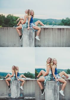 two beautiful young women sitting on top of a cement wall next to eachother