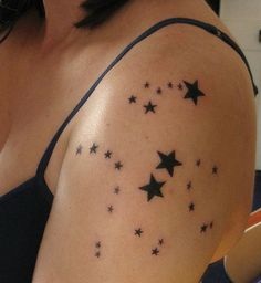 a woman's arm with stars on it