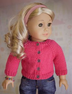 a doll with blonde hair wearing a pink sweater and jeans