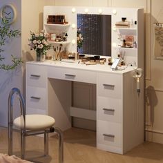 a white vanity with lights on it in a room next to a mirror and chair