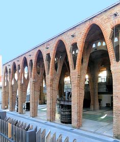 an old brick building with arches and windows