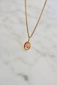 This tiny natural sunstone necklace is the perfect daily necklace for sunstone lovers. The necklace is 14k gold filled with a beautiful natural sunstone pendant in orange with copper schiller. The sunstone is set in 18 k gold. The pendant is 7x5mm. Layer it with your favorite necklaces, or wear it alone - it's perfect either way! About sunstone: The Stone of Good Fortune A warm stone with summer moods, first discovered here in Norway. It is said that the Vikings used this shimmering bright stone Orange Pendant Necklace, Orange Gemstone Necklace, Sunstone Necklace, Daily Necklace, Sunstone Jewelry, The Vikings, Jewelry Dainty, Native American Culture, Etsy Personalized Gifts