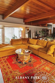 a living room filled with furniture and a large rug