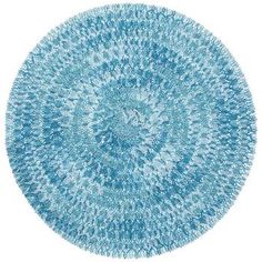 a circular blue rug on a white background