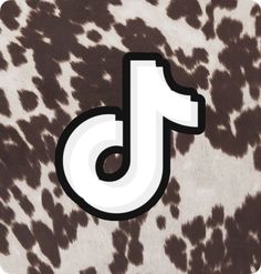 the letter j is made up of black and white spots on a leopard print background