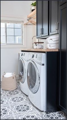 a washer and dryer in a small room