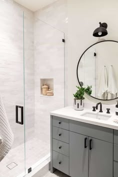 a bathroom with a sink, mirror and towel rack