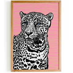 a black and white drawing of a leopard on a pink background in a wooden frame