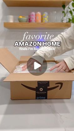 an amazon box is open with someone opening it