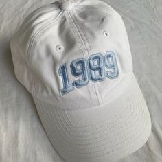 a white baseball cap with the number 991 embroidered on it