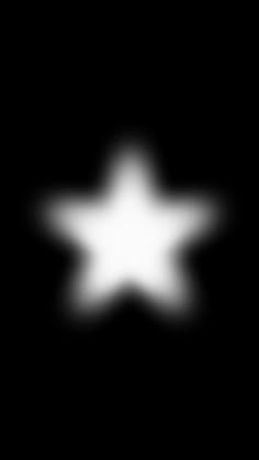 a black and white image of a star in the dark