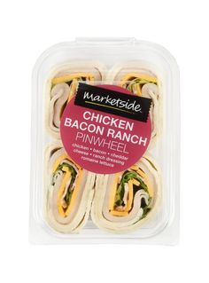 chicken bacon ranch pinwheel sandwiches in a plastic container