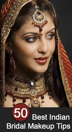 a woman wearing a red and gold bridal outfit with jewelry on her head, in front of a black background