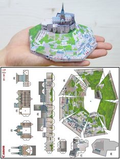 a paper model of a castle in someone's hand, with instructions on how to make it