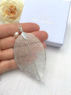 This delicate real leaf pendant with a beautiful freshwater pearl was originally a custom order from a close friend who was planning her autumnal wedding. She wanted her bridesmaid's jewellery to match her autumnal leaf theme and colours.  You can choose between a rose gold plated or silver plated finish on the leaf pendant. The necklaces come in a cardboard box wrapped in a ribbon. If you would like to add a personalised message or would like to customise this piece in any way please get in touch. Leaf Necklace Silver, Rose Gold Leaf, Necklace Leaf, Gold Leaf Pendant, Real Leaf, Real Pearl Necklace, Necklace Rose Gold, Pearl Hair Pins, Necklace Bridal