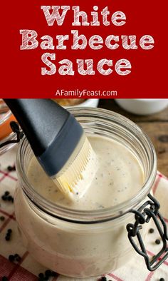 white barbecue sauce in a mason jar with a brush sticking out of it and text overlay that reads, white barbecue sauce