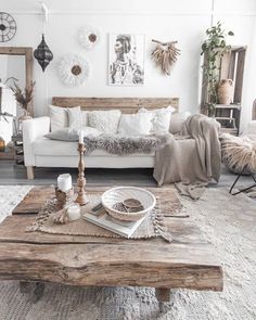 a living room filled with lots of furniture and decor on top of a wooden table