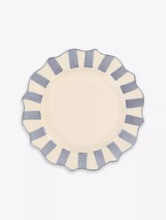 a blue and white striped plate on a white background with an empty space in the middle