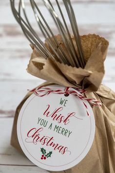 we wish you a merry christmas ornament in a gift bag with a whisk