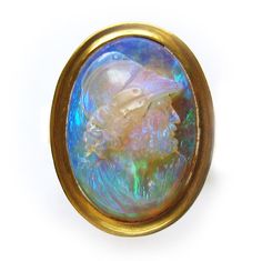 A Victorian opal cameo ring A Victorian opal cameo ring, the oval opal carved in the form of a bearded man with Roman helmet, measuring approximately 19.5 x 13.5 mm, rubover-set to a yellow gold mount with closed back, with tapered D-section shank, gross weight 12.6 grams, circa 1870 Roman Helmet, Bearded Man, Caving, Cameo Ring, Stunning Jewellery