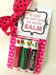 three lip balm tubes in a pink box with a bow on the side and a sign that says, in case you didn't know you are the balm