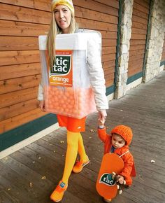 a woman and child dressed up as oranges