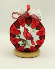 a christmas ornament with a cardinal on it